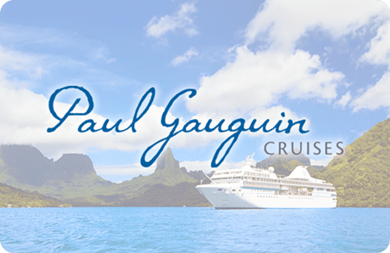 Paul Gauguin Cruise ship sailing near tropical islands under a blue sky.